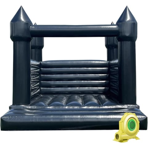 Black inflatable bounce house with castle towers and yellow air blower pump on white background